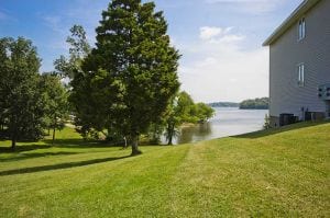 Side of a condo and lake view.