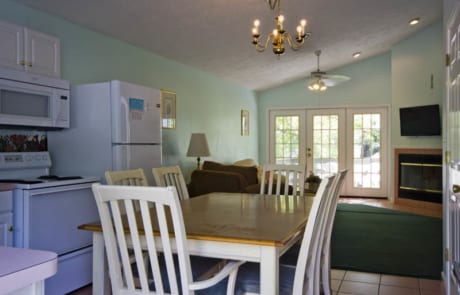 Woodland Villa - kitchen, dining table and living room.