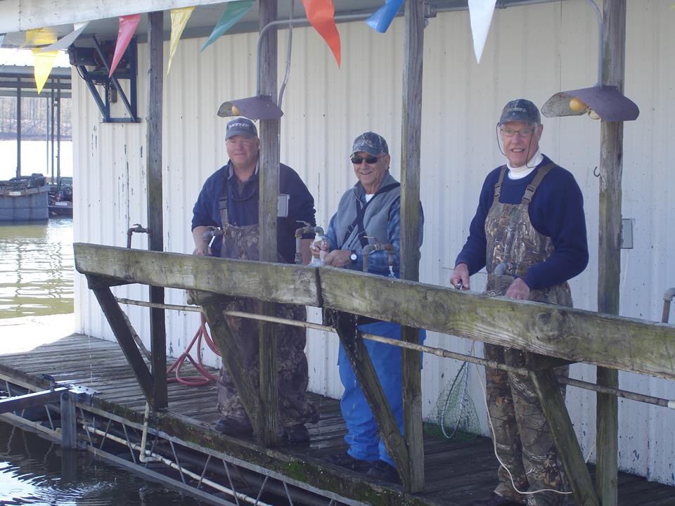 Guide and fishermen in the cleaning station.