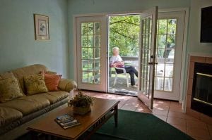 Woodland Villa - Guest sitting on the patio.